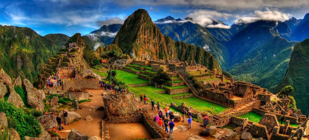 Cruise passengers enjoying a private  shore excursion Machu Picchu from El Callao Port with panoramic views of the Inca citadel.